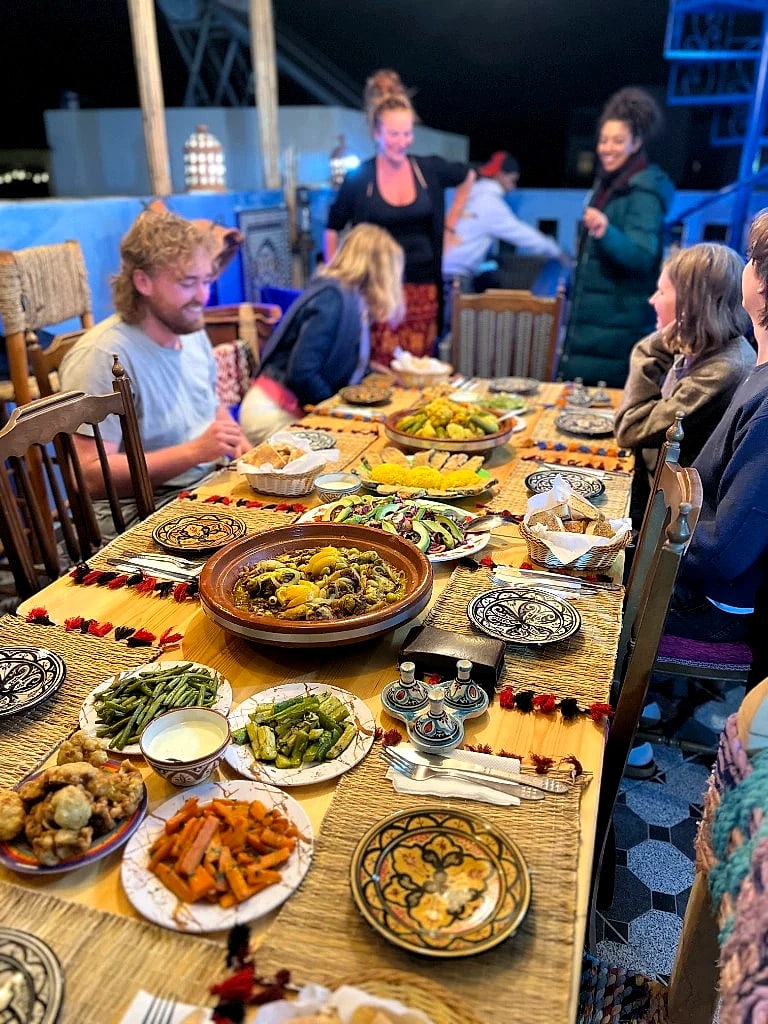 Guests sharing a Moroccan dinner